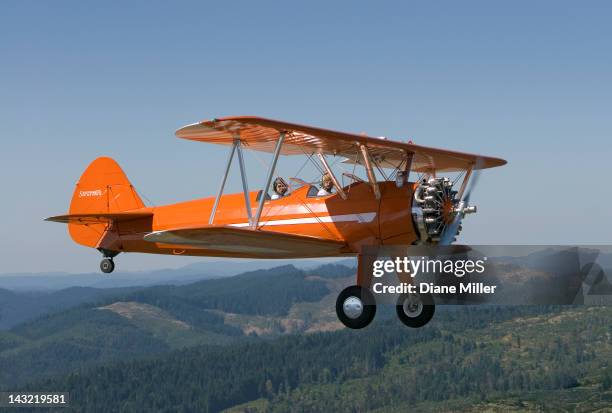 1943 stearman biplane - biplane stock pictures, royalty-free photos & images