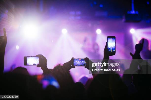 rock band performing on stage at night club - music crowd stock pictures, royalty-free photos & images