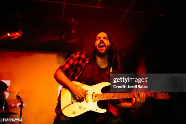 rock band performing on stage at night club - heavy metal guitarist stock pictures, royalty-free photos & images