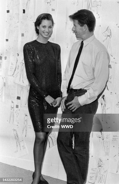 Designer Calvin Klein poses with model Christy Turlington inside of Klein's New York City design studio art 205 West 39th Street.