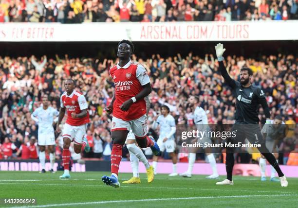 Bukayo Saka celebrates scoring the 2nd Arsenal goal during the Premier League match between Arsenal FC and Liverpool FC at Emirates Stadium on...