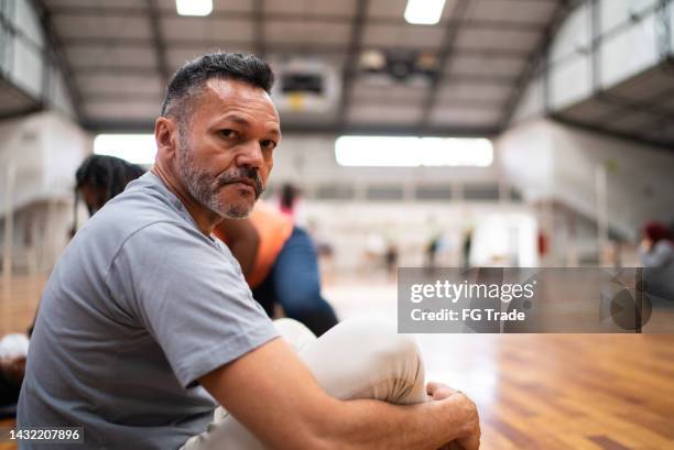 portrait of a refugee man in a sheltering - homeless shelter man stock pictures, royalty-free photos & images