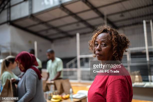 portrait of a refugee woman in a sheltering - woman bum stock pictures, royalty-free photos & images