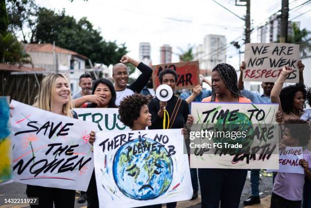 people protesting in the street - person justice stock pictures, royalty-free photos & images