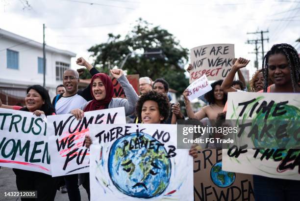 people protesting in the street - women's rights stock pictures, royalty-free photos & images