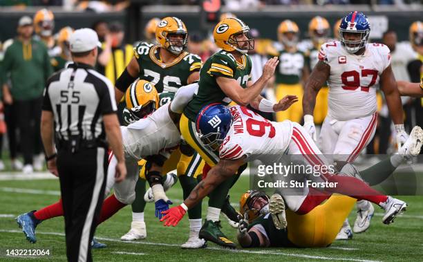 Aaron Rodgers is tackled by Giants defensive lineman Nicholas Williams during the NFL match between New York Giants and Green Bay Packers at...