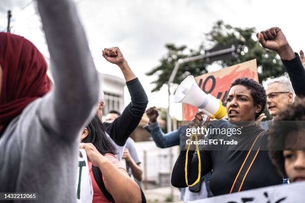 people protesting in the street - blm riot stock pictures, royalty-free photos & images