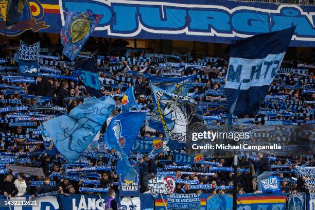 Supporters of Djurgardens IF hold up scarves durring an Allsvenskan match between Djurgardens IF and BK Hacken at Tele2 Arena on October 9, 2022 in...