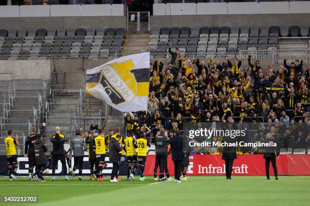 Players from BK Häcken celebrate in front of their traveling supporters durring an Allsvenskan match between Djurgardens IF and BK Hacken at Tele2...