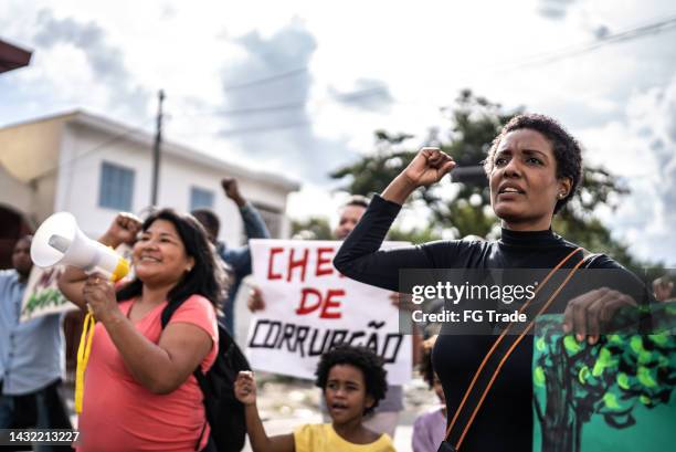 brazilian people protesting against corruption outdoors - childrens justice campaign event imagens e fotografias de stock