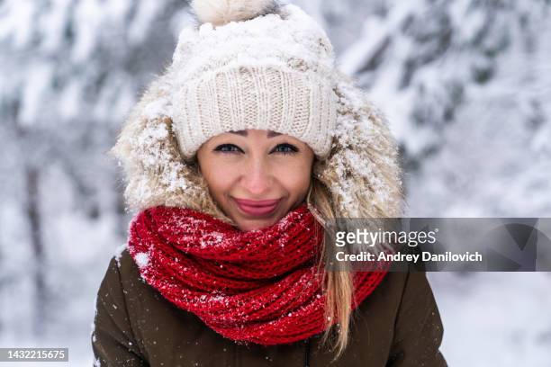 portrait of beautiful young woman in the winter forest. - parka stock pictures, royalty-free photos & images