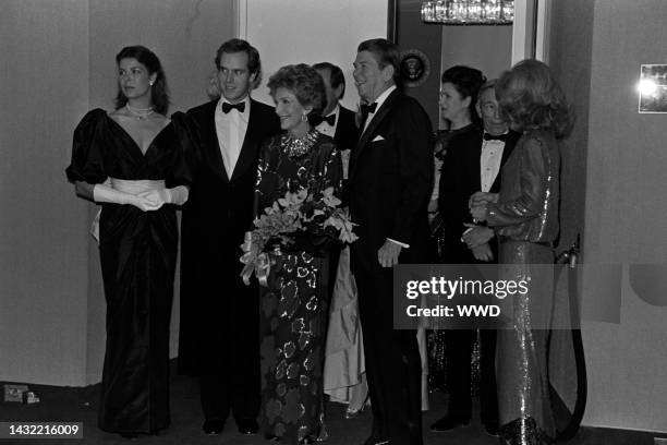 Princess Caroline of Monaco, Prince Albert of Monaco, Nancy Reagan, Ronald Reagan, and Lynn Wyatt attend a reading of Ogden Nash verses, set to the...