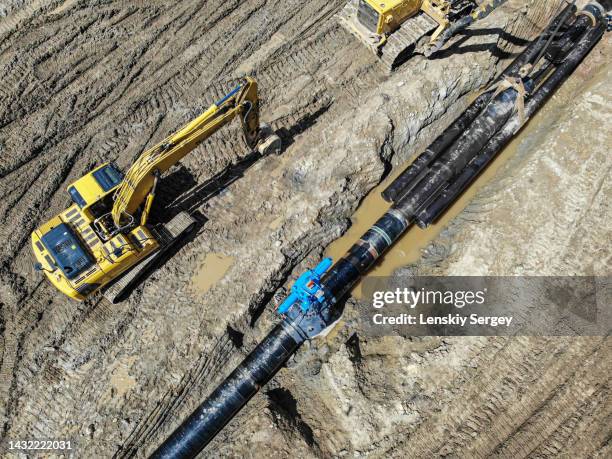 air photography excavator on gas pipeline construction - tube wave stock pictures, royalty-free photos & images