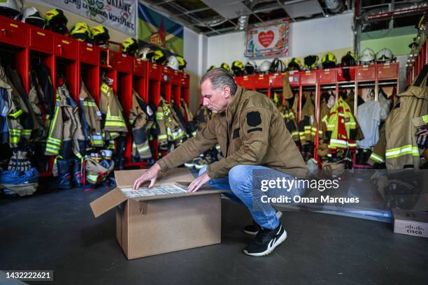 Firefighter opens a box full of Iodine tablets inside the Firefighters headquarters that is one of the distribution points on October 10, 2022 in...