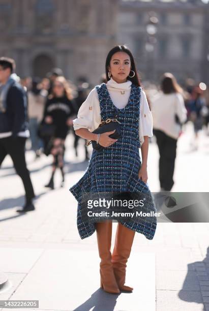 Yoyo Cao seen wearing a total Louis Vuitton look, outside Louis Vuitton during Paris Fashion Week on October 04, 2022 in Paris, France.