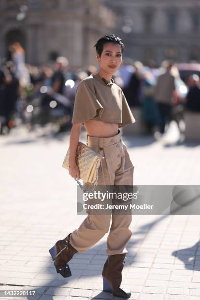 Molly Chiang seen wearing a total Louis Vuitton look, outside Louis Vuitton during Paris Fashion Week on October 04, 2022 in Paris, France.