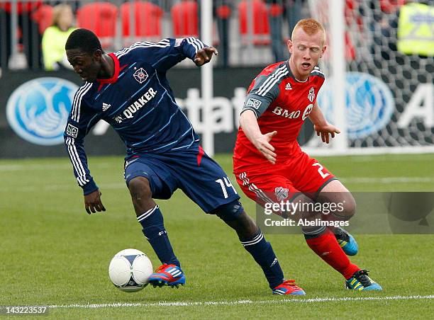 Richard Eckersley of Toronto FC gets the ball stripped by Patrick Nyarko of Chicago Fire during MLS action at BMO Field April 21, 2012 in Toronto,...