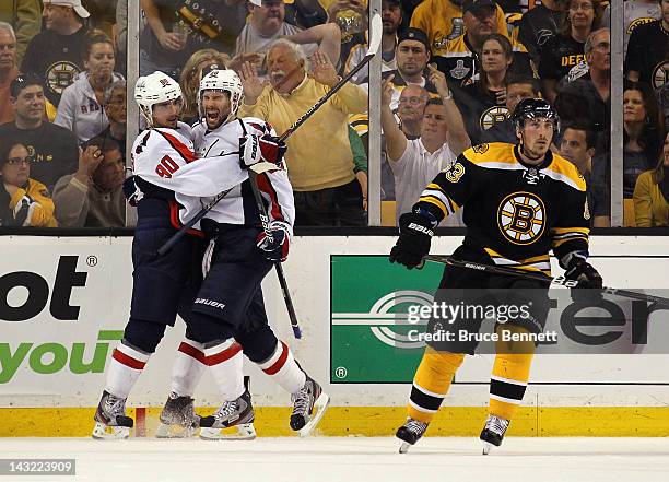 Troy Brouwer of the Washington Capitals celebrates his game winning powerplay goal at 18:33 along with Marcus Johansson against the Boston Bruins in...