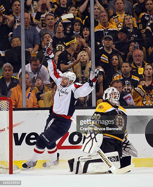Troy Brouwer of the Washington Capitals celebrates his game winning powerplay goal at 18:33 against Tim Thomas of the Boston Bruins in Game Five of...