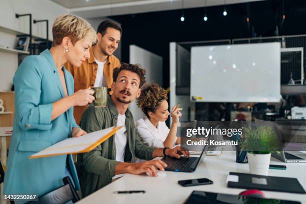 a group of students consults with a female professor about program coding - java stock pictures, royalty-free photos & images