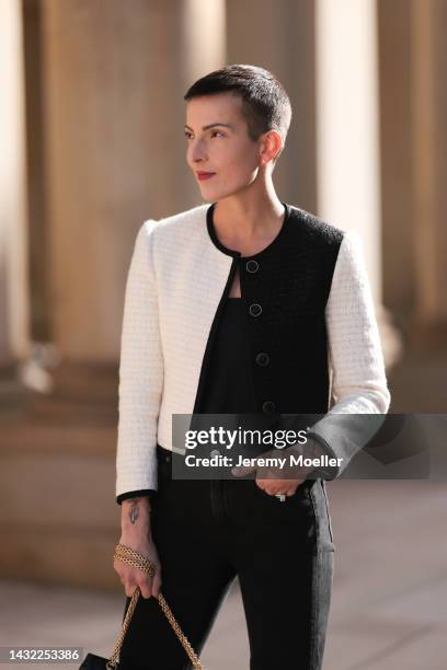 Tereza Brink wearing a black Chanel 2.55 bag, black and white Yves Saint Laurent blazer and Agolde black denim pants on October 06, 2022 in Hamburg,...