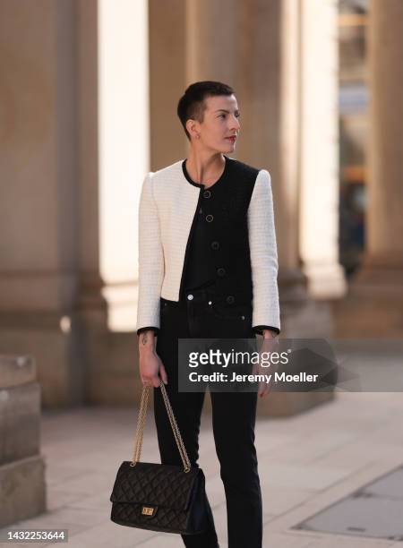 Tereza Brink wearing a black Chanel 2.55 bag, black and white Yves Saint Laurent blazer and Agolde black denim pants on October 06, 2022 in Hamburg,...