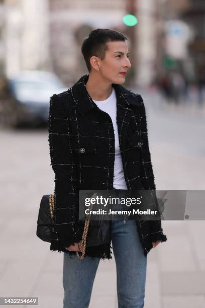 Tereza Brink wearing Chanel 2.55 big black leather bag, Chanel vintage tweed jacket, blue Agolde denim and white Zara top on October 06, 2022 in...