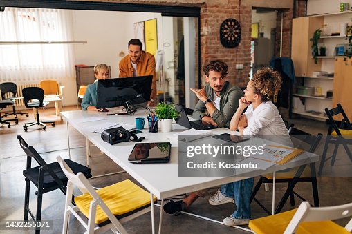 A diverse group of new programmers work in pairs and master coding techniques A diverse group of new programmers work in pairs and master coding techniques