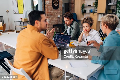 A group of students learn coding at a workshop for new programmers A group of students learn coding at a workshop for new programmers