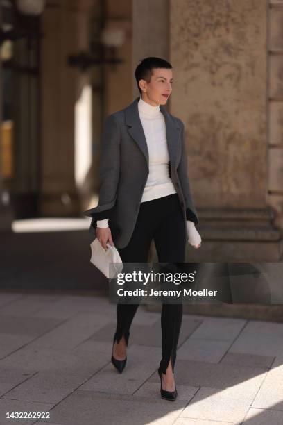 Tereza Brink wearing Bottega Veneta white leather bag and blazer, white Bottega Veneta top, black Givenchy heels, Wardrobe NYC black skinny leggings...