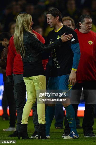 Goalkeeper Roman Weidenfeller of Dortmund celebrates with Ulla Klopp, wife of head coach Juergen Klopp, after winning the Bundesliga match between...
