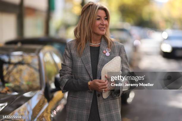 Yasmin von Schlieffen-Nannen wearing white Bottega Veneta bag, grey Valentino dress and grey Golden Goose blazer on October 07, 2022 in Berlin,...