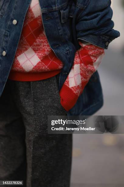 Yasmin von Schlieffen-Nannen wearing blue Acne Studios jeans jacket, red Essential Antwerp sweater, Isabel Marant Etoile pants on October 07, 2022 in...