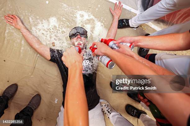 Pitcher Sam Hentges of the Cleveland Guardians and teammates celebrate in the clubhouse after defeating the Tampa Bay Rays in Game Two of the Wild...