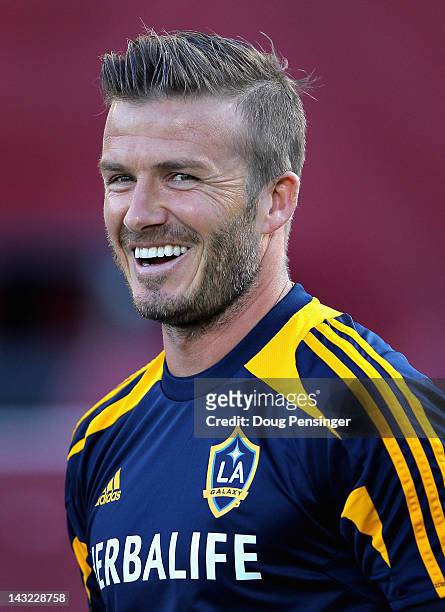 David Beckham of the Los Angeles Galaxy looks on as he warms up prior to facing the Colorado Rapids at Dick's Sporting Goods Park on April 21, 2012...