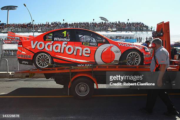 The Team Vodafone Holden of Jamie Whincup is returned to the pits after he hit the wall during qualifying for race six of the V8 Supercar...