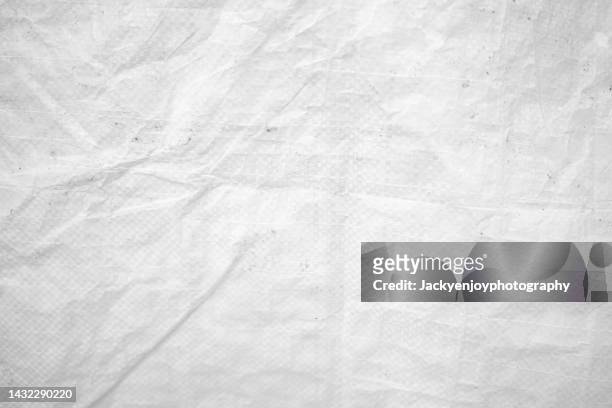crumpled gray paper background - wrinkled paper stockfoto's en -beelden