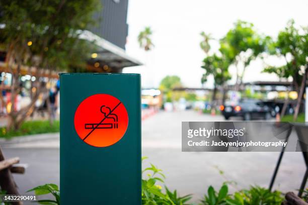 no smoking sign on street - quit smoking stock-fotos und bilder