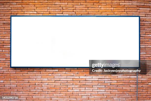 billboard banner signal mock up display on red brick wall and sidewalk - road signal ストックフォトと画像