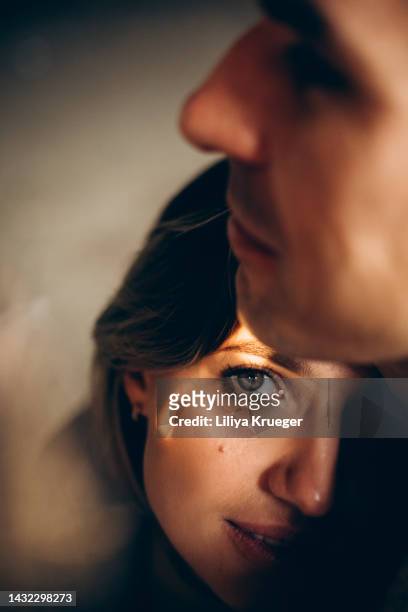 close-up of loving couple. - portrait woman men looking at each other stock-fotos und bilder