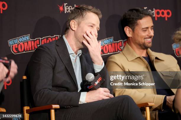 Josh Dallas and JR Ramirez speak onstage during a panel with Netflix's Manifest at New York Comic Con on October 08, 2022 in New York City.