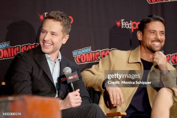 Josh Dallas and JR Ramirez speak onstage during a panel with Netflix's Manifest at New York Comic Con on October 08, 2022 in New York City.