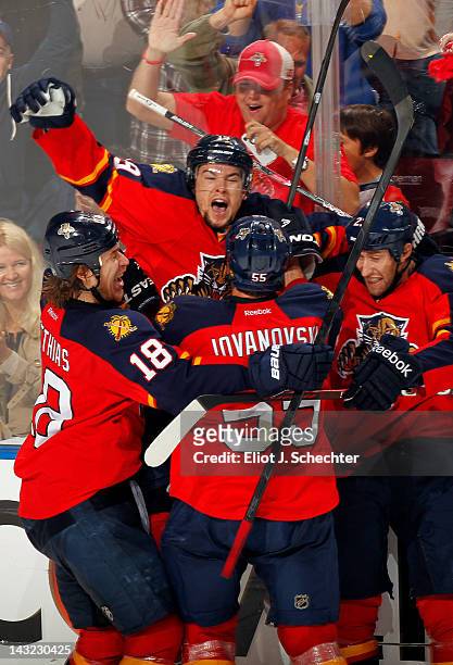 Scottie Upshall of the Florida Panthers celebrates his goal with teammates against the New Jersey Devils in Game Five of the Eastern Conference...