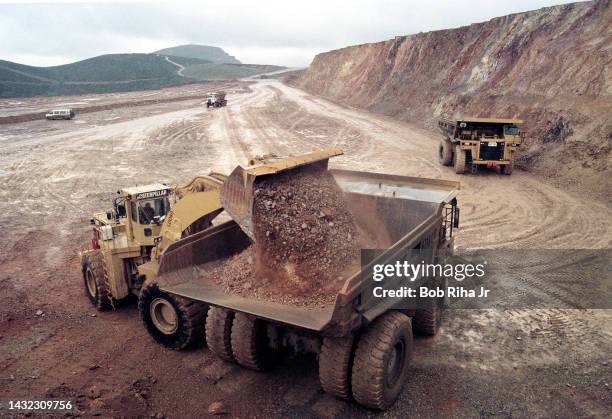 Dirt containing micro-particles of gold are loaded onto 150-Ton dump trucks at Newmont Gold Company Deep Star Mine, June 5, 1997 in Elko, Nevada.