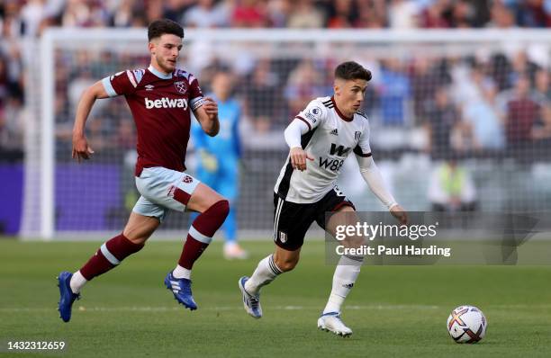 Harry Wilson of Fulham gets away from Declan Rice of West Ham United during the Premier League match between West Ham United and Fulham FC at London...