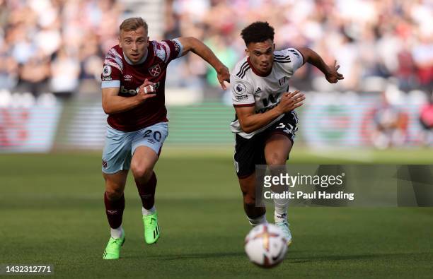 Jarrod Bowen of West Ham United and Antonee Robinson of Fulham compete for the ball during the Premier League match between West Ham United and...