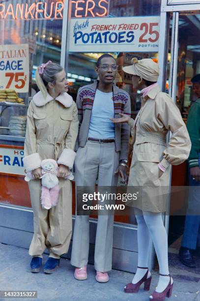 Designer Willi Smith with Toukie Smith and a model in his Digits fall collection. Shot on location in New York's Times Square.
