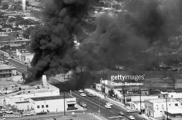 Three stores burn to the ground on Avalon Boulevard in Watts as the fire department was unable to get to the scene of the fire due to rioting ....