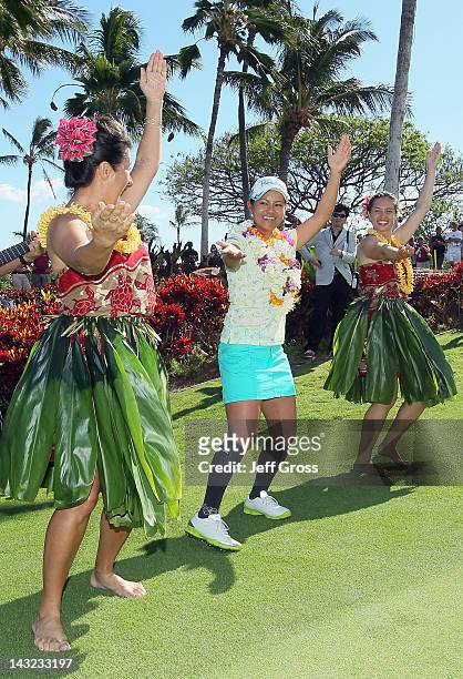 Ai Miyazato of Japan celebrates by dancing with hula dancers after winning the LPGA LOTTE Championship Presented by J Golf at the Ko Olina Golf Club...
