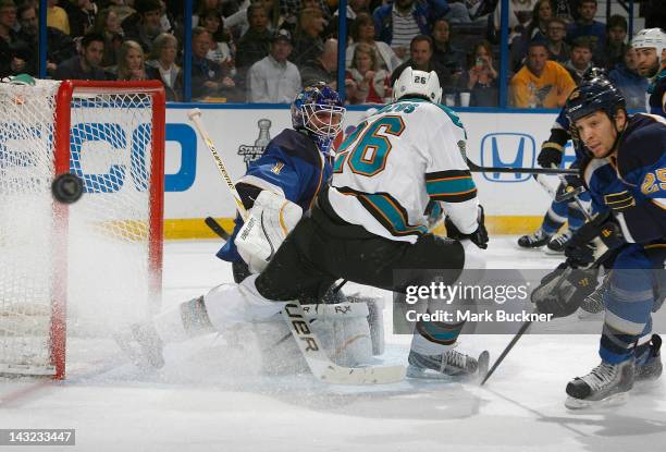 Brian Elliott of the St. Louis Blues defends the net against Michal Handzus of the San Jose Sharks in Game Five of the Western Conference...